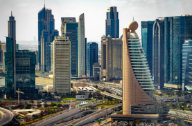 Dubai World Trade Centre dwarfed by skyscrapers